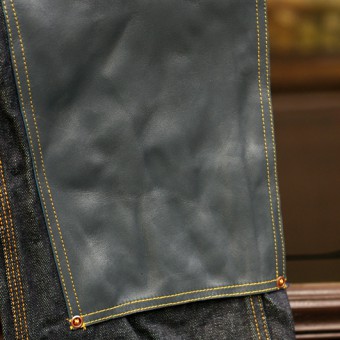 LEATHER-FRONT DENIM PANTS