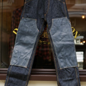 LEATHER-FRONT DENIM PANTS